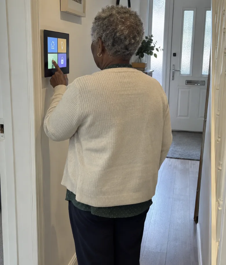Customer answering a video doorbell from the hallway panel