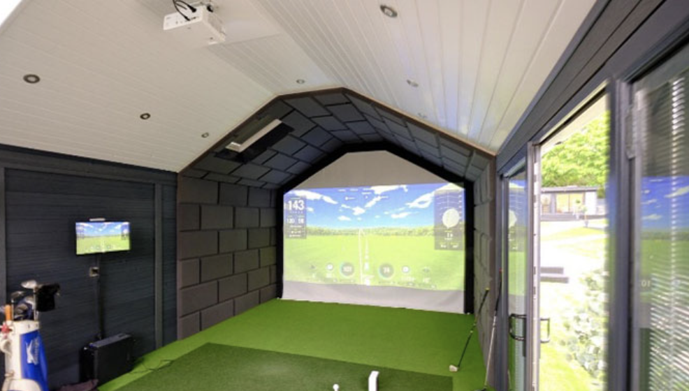 Golf simulator inside a garden room with bifold doors